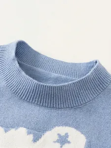 Blue knitted vest for boys featuring white star patterns and a ribbed crew neckline