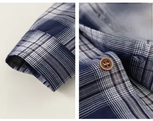Détail d'une chemise à carreaux en coton avec boutons marron et poignets confort
