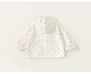 Rear view of a white kids hooded jacket featuring colorful polka dots and elastic cuffs