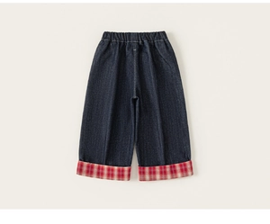 Detail of elastic waistband and red plaid lining on kids deep blue denim wide-leg pants
