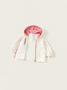 Girl's hooded windbreaker with colorful polka dots and pink lining for spring outdoor use