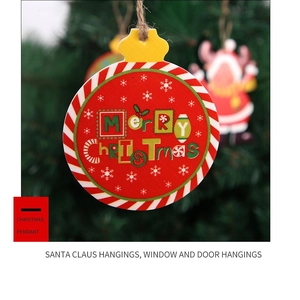 Close-up of Merry Christmas wooden hanging ornament with snowflake patterns on a tree