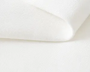 Detailopname van de zachte witte gebreide katoenen textuur met een glad weefpatroon