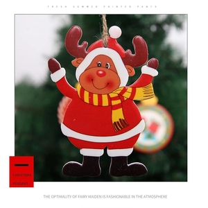 Detail of a cartoon reindeer Christmas ornament with a red scarf and rustic jute rope