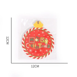 Detail view of 12cm Merry Christmas round wooden ornament in protective packaging