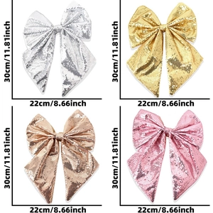 Dettaglio di grandi fiocchi glitterati da 30cm in argento, oro, champagne e rosa