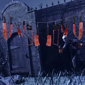 Detailed view of bloody weapon banners including cleavers and saws for Halloween decor