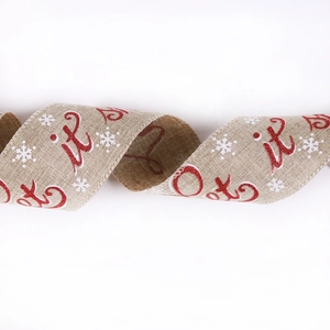 Close-up of 10m faux burlap Christmas ribbon with red glitter Let it text and snow