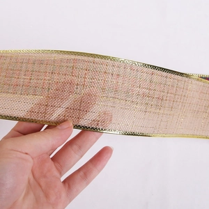 Close-up of champagne gold mesh ribbon with metallic wire edge for Christmas gift wrapping