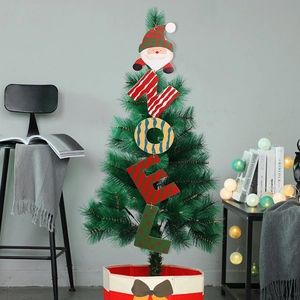 Wooden NOEL Christmas ornament with Santa Claus hanging on a festive decorated tree