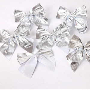 Set of six silver metallic glitter bows for Christmas tree decoration and gift wrapping