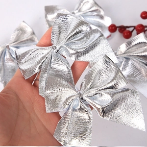 Detail shot of silver metallic bows for Christmas tree decoration and gift wrapping