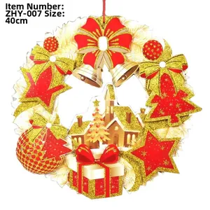 Detail of a 40cm Christmas paper wreath with red and gold sequins and festive ornaments