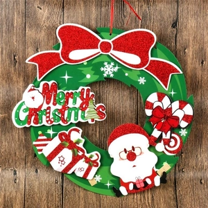 Christmas paper wreath wall decoration with red bow and 3D Santa Claus ornament