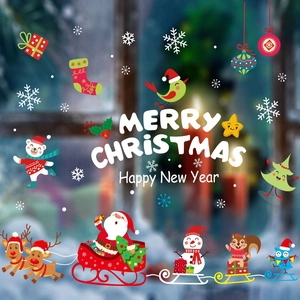 Detailed Christmas window decals featuring Santa, reindeer, and snowflakes on a festive backdrop