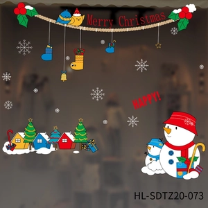 Detail of Christmas window stickers featuring colorful snowmen, trees, and birds
