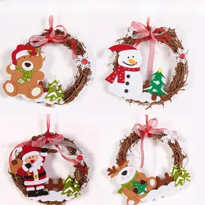 Detail of four handmade Christmas rattan wreaths featuring Santa, snowman, bear and reindeer