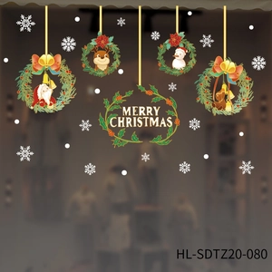 Detail of static Christmas window stickers featuring Merry Christmas wreaths and snowflakes