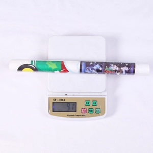 Detailed view of Merry Christmas wall stickers roll on scale weighing 91g for holiday decor