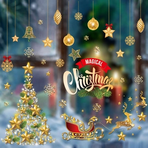 Detail of gold Christmas window stickers featuring reindeer and tree on glass surface