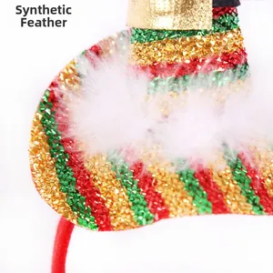 Detail of glitter Christmas hat headband with sequins and white faux feather trim