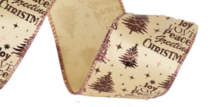 Gros plan du ruban de Noël champagne avec impression métallique festive Joy et Peace