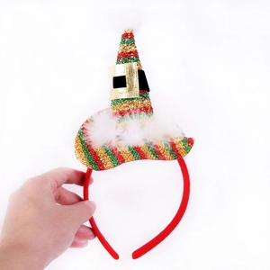 Detail of Christmas headband with red green gold conical hats and white plush feather trim