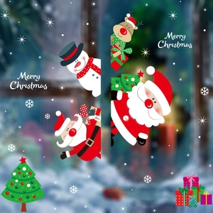 Close-up of colorful Christmas window stickers with Santa Claus and snowman motifs