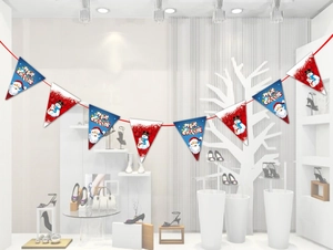 Detail of Christmas banner flags featuring Santa and Snowman designs for party decor