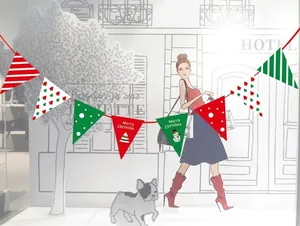 Close-up of festive Christmas paper bunting flags in red green and white patterns