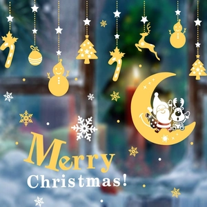 Golden and white Christmas window decals featuring reindeer, snowman, and stars patterns