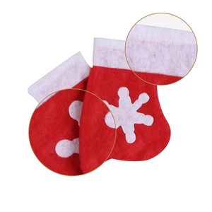 Detail of red Christmas mini socks showing sewing quality and white snowflake patterns