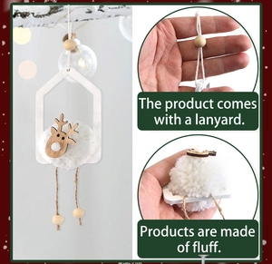 Detail view of plush pom-pom and wooden reindeer head on a Christmas tree ornament