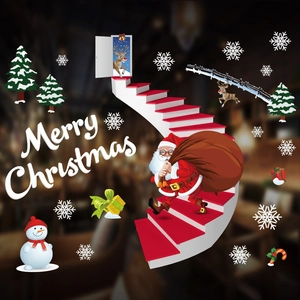 Detail of Christmas window stickers featuring Santa, snowman, and tree in vibrant colors