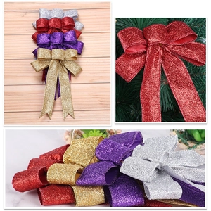 Macro detail of glittering Christmas bow decoration with shiny metallic sequins texture