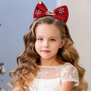 Christmas headband with red bow and Merry Christmas text worn by a child for holiday party