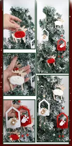 Detail of wooden Christmas reindeer and house ornaments with soft wool pom poms