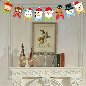 Christmas paper bunting banner featuring Santa and reindeer over a cozy fireplace mantle