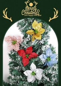 Glitter poinsettia ornaments in five colors on a snowy Christmas tree for party decor