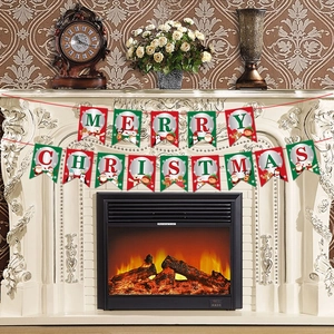 Red and green Merry Christmas paper banner hanging over a warm cozy fireplace