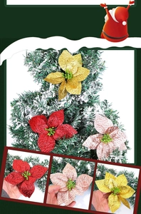 Detailed view of artificial Christmas poinsettias in red, gold, and pink on tree