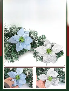 Detail of fabric poinsettia flowers with blue satin petals and silver glitter texture