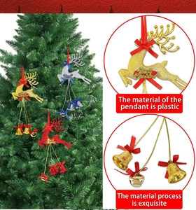Detail of glitter elk ornaments with Merry Christmas text and red bows for Christmas tree