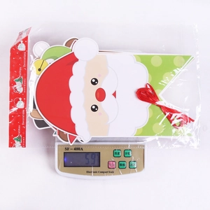 Christmas Santa banner package showing the lightweight 59g weight on a digital scale