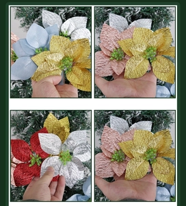 Close-up of sparkling artificial poinsettia flower heads for Christmas tree decoration
