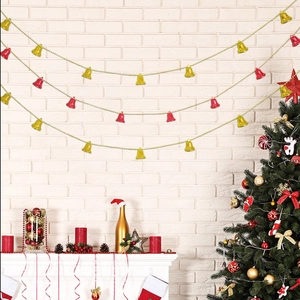 Detail of 2M red and gold Christmas bell garland hanging on a fireplace mantel