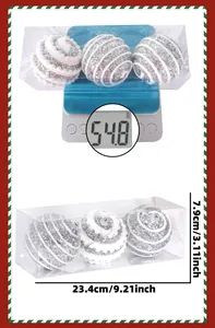 Three silver sequined Christmas balls in a clear box with size and weight measurements
