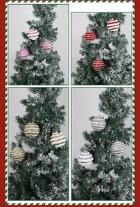 Detail of glittered Christmas foam balls with embossed wave texture hanging on a tree