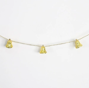 Detail showing Christmas bells with floral embossing on a gold bead chain hanging