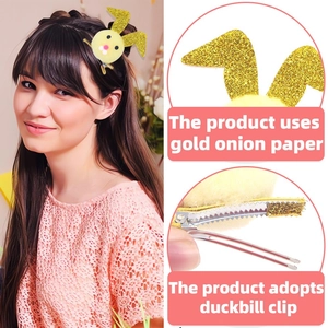 Detail of yellow plush rabbit hair clip with gold glitter ears and a metal duckbill clip